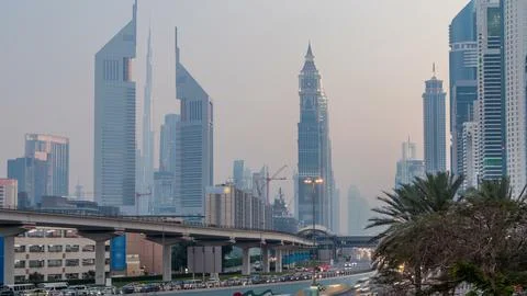 Traffic on intersection and bridge at the Sheikh Zayed Road day to night ti.. Stock Photos
