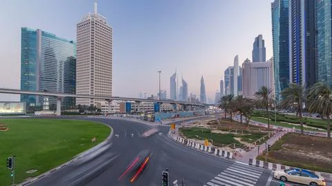 Traffic on intersection and bridge at the Sheikh Zayed Road day to night ti.. Stock Photos