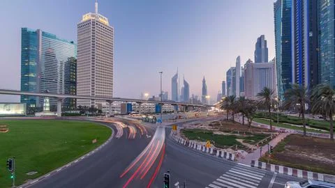 Traffic on intersection and bridge at the Sheikh Zayed Road day to night ti.. Stock Photos
