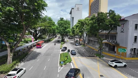Traffic intersection junction view from above incoming cars Singapore urban Stock Footage 335373458