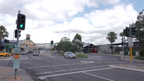 Traffic intersection near station area with cars, traffic lights, and Stock Footage 333520112