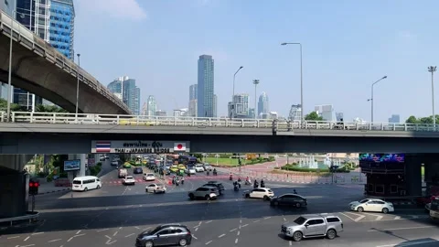 Traffic of intersection at Silom Road with Sky Train in Bangkok city Stock Footage 301057006