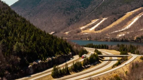 Traffic on interstate highway with shipping and recieving trucks making deli Stock Footage 194544574