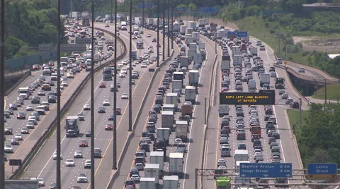 Traffic jam and bumper to bumper commuter gridlock on the 401 in Toronto Stock Footage 51608570