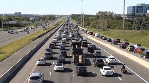Traffic jam and highway gridlock as commuters head home after work Stock Footage 92394451