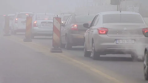 Traffic Jam in Bucharest on Mist and Fog Seamless Loop Stock Footage 127665510