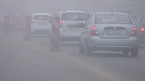 Traffic Jam in Bucharest on Mist and Fog Stock Footage 127667186