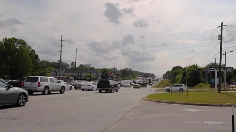Traffic jam on a busy highway on a cloudy day Stock Footage 153571369