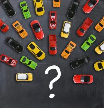Traffic jam concept with multiple toy cars on a blackboard Stock-Fotos