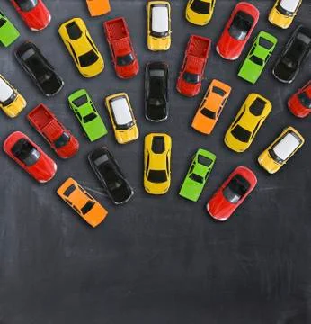 Traffic jam concept with multiple toy cars on a blackboard Stock-Fotos