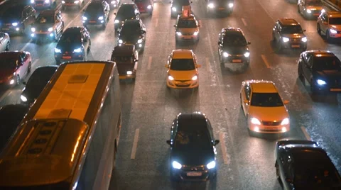 Traffic jam, dense slow flow of cars on a freeway at night, time-lapse. Stock Footage 54315328