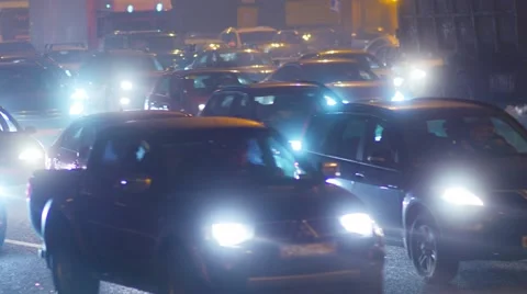 Traffic jam, dense slow flow of cars on a freeway at night. Video stock 54315775