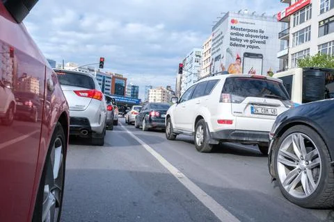 Traffic jam during rush hours and a lot of cars waiting to go after lights Stock Photos