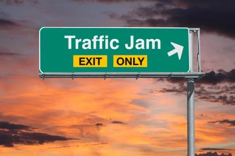 Traffic Jam Exit Only Freeway Sign with Sunrise Sky Stock Photos