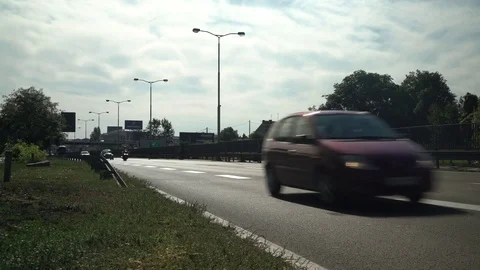 Traffic jam on freeway, fast speed drive, rush hour on highway, back light. Stock Footage 82464603