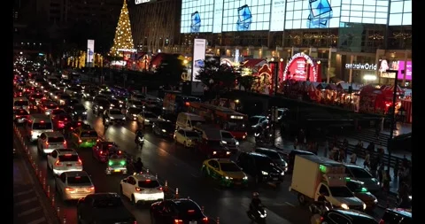 Traffic jam at the front of mall, busy street at night Stock Footage 305526233