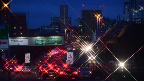 Traffic jam heading into the city centre of leeds at twilight yorkshire uk Stock Footage 122440770
