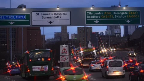 Traffic jam heading into the city centre of leeds at dawn yorkshire uk Stock Footage 122441404