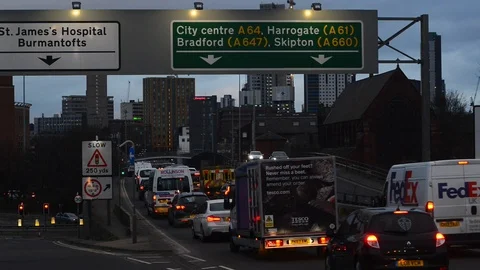 Traffic jam heading into the city centre of leeds at twilight yorkshire uk Stock Footage 126212018