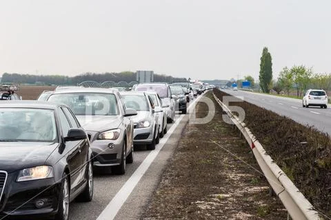 Traffic jam on highway during rush hour Stock Photos