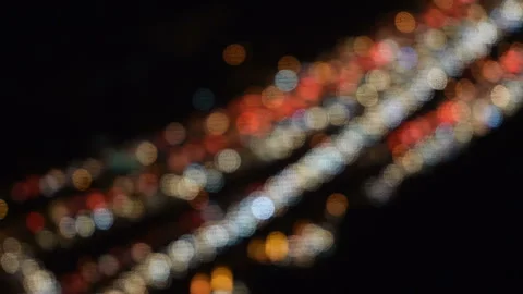 Traffic jam on highway at night with defocused light Stockbeeldmateriaal 143578775