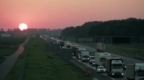 Traffic jam on the highway in the sunset Video stock 67625970