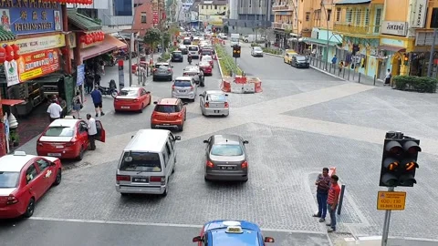 Traffic jam at intersection in Kuala Lumpur, Malaysia at normal original  speed Stock Footage 149762238