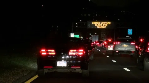 Traffic Jam- Major Deegan South- Signs for Manhattan &amp; Winter Weather Alert Stock Footage 100565701