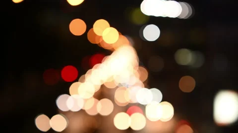 Traffic jam at night with defocused light Stock Footage 143579037