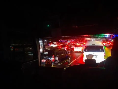 Traffic jam at night as seen from inside the bus Stock Photos