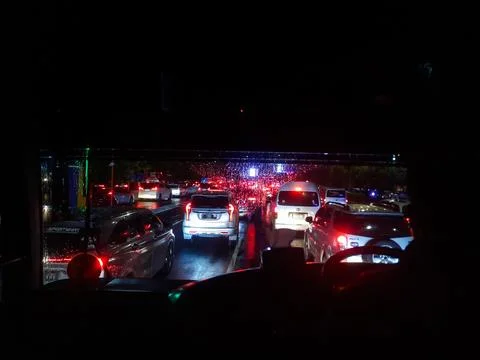 Traffic jam at night as seen from inside the bus Stock Photos