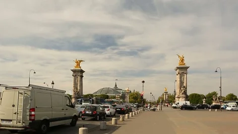 Traffic jam in Paris.People walking on the side way near Alexandre III Bridge Stock Footage 76760843