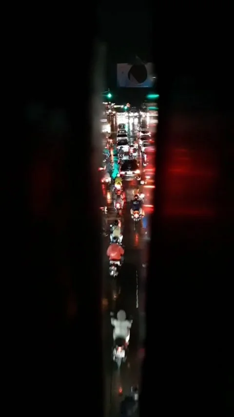 Traffic jam at a red light at a crossroads when it rains Stock Footage 214191776