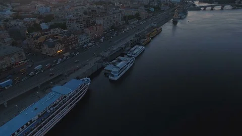 Traffic jam on the road along the river with boats at sunset aerial Stock Footage 90232618
