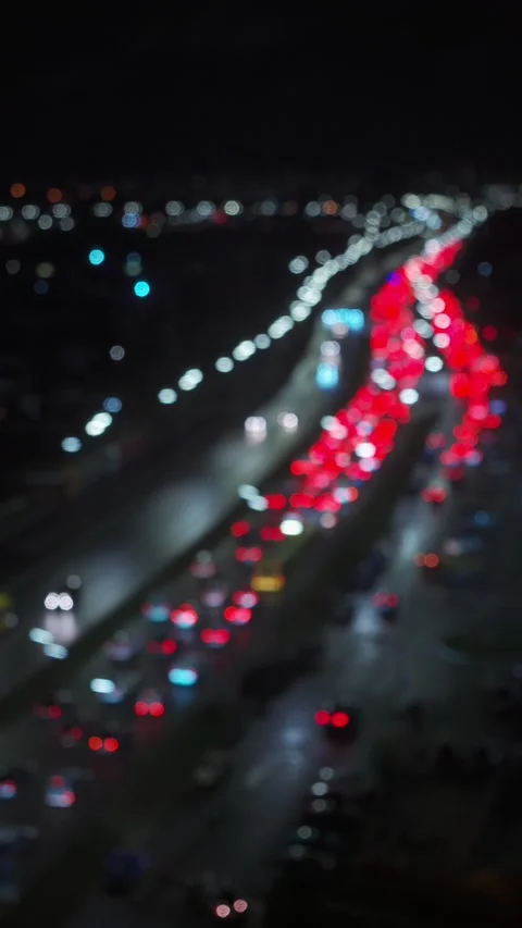 Traffic Jam in the rush hour on highway. Car traffic in the city at Night Stock Footage 255786504