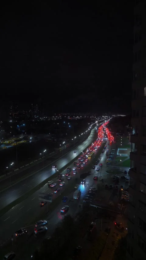 Traffic Jam in the rush hour on highway. Car traffic in the city at Night Stock Footage 255786512