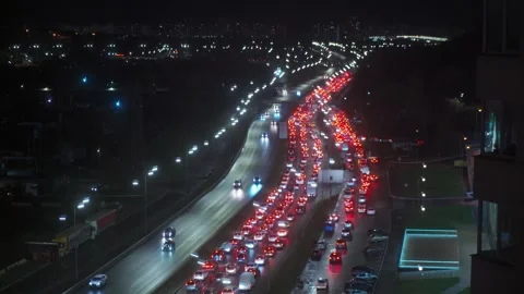 Traffic Jam in the rush hour on highway. Car traffic in the city at Night Video stock 255786571