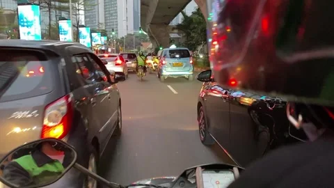 Traffic jam seen through motorcycle in Jakarta, Indonesia Stock Footage 287825284