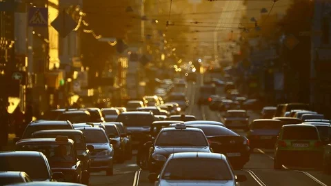 Traffic jam in smog through urban street Stock Footage 76466974