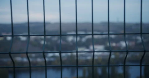 Traffic jam through a fence Stock Footage 163357532