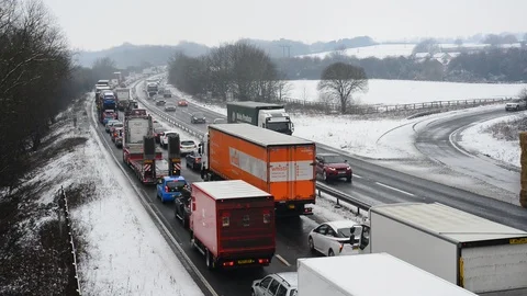 Traffic jam in winter snow on the a64 tadcaster yorkshire uk Stock Footage 87166096