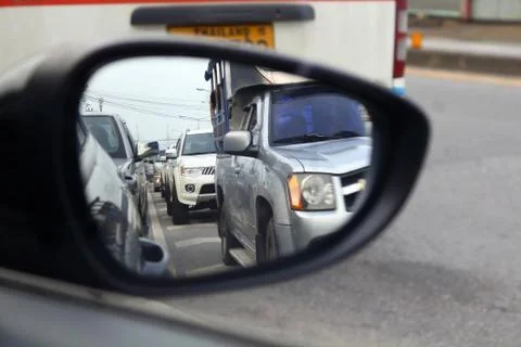 Traffic jaming looking from side mirror Stock Photos