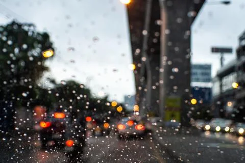 Traffic jams view through a window on a rainy day, droplets on the glass Stock Photos