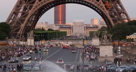 Traffic on Jena Bridge and Eiffel Tower at sunset in Paris, France Stock Footage 260689314