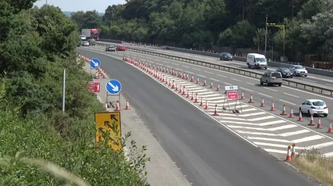 Traffic joining motorway with cones Stock Footage 66303368