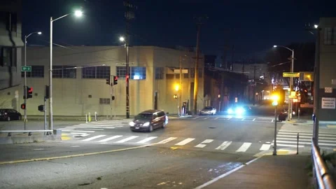 Traffic junction - car turning left through an amber/red light Stock Footage 233468867