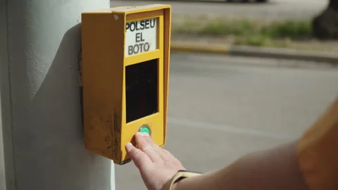 Traffic light activation button at pedestrian crossing pressed by woman hand. Stock Footage 335638544