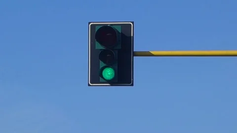 Traffic light against clear blue sky Video stock 69860423