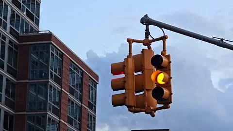 Traffic Light and Building, A green traffic light with a modern building and Stock Footage 299913784