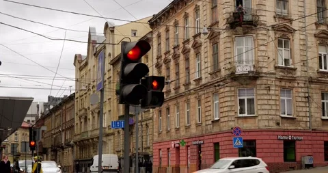 A traffic light on the background of an ancient beautiful city Stock Footage 240094271